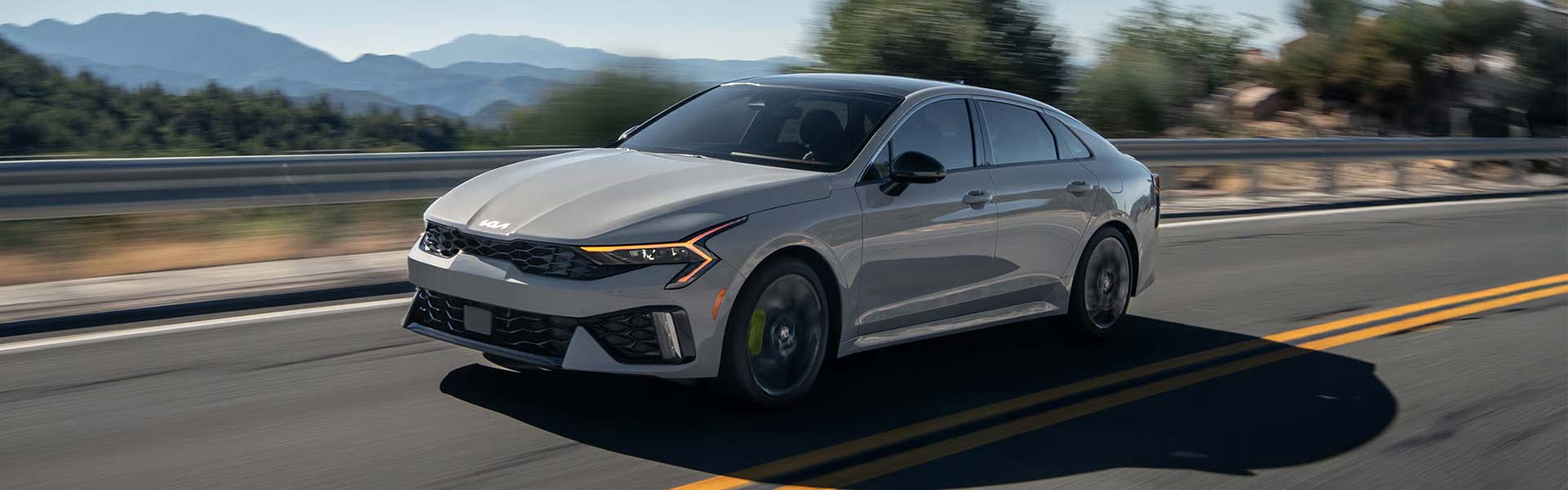 2026 Kia K5 sedan driving on road